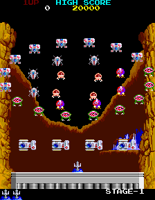Return of the Invaders arcade screenshot showing colorful aliens descending between rocky side walls